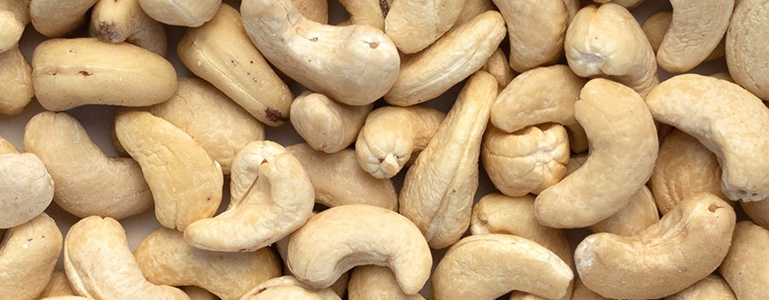 Close up photo of raw cashews.