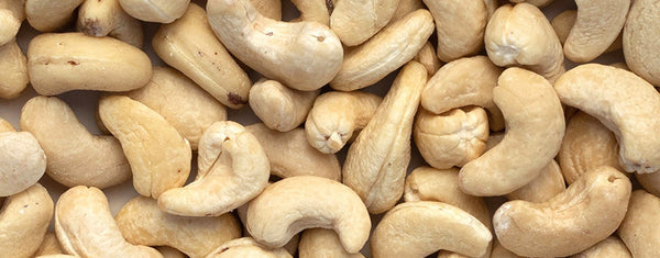 Close up photo of raw cashews.
