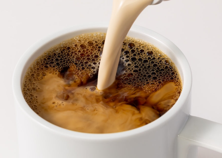 Forager Project Unsweetened Creamer being poured into a cup of coffee