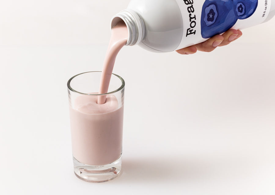 Forager blueberry drink being poured into a glass