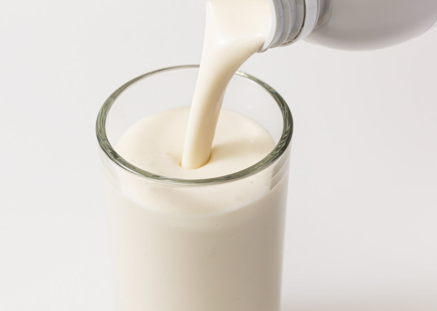drink being poured from a carton into a glass