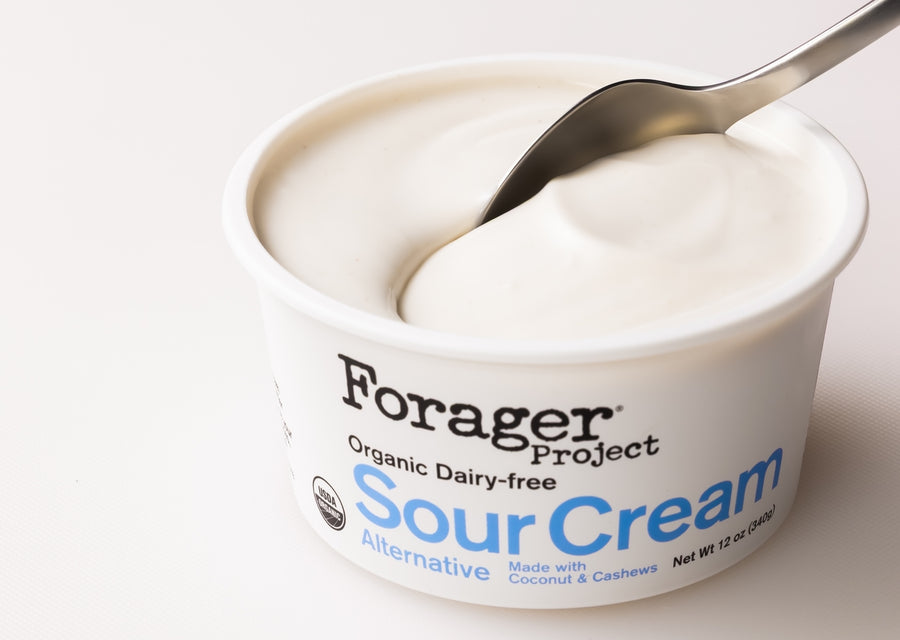 Forager Project Sour Cream with a spoon inside on a white background