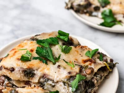 Serving of a spinach and lentil lasagna.