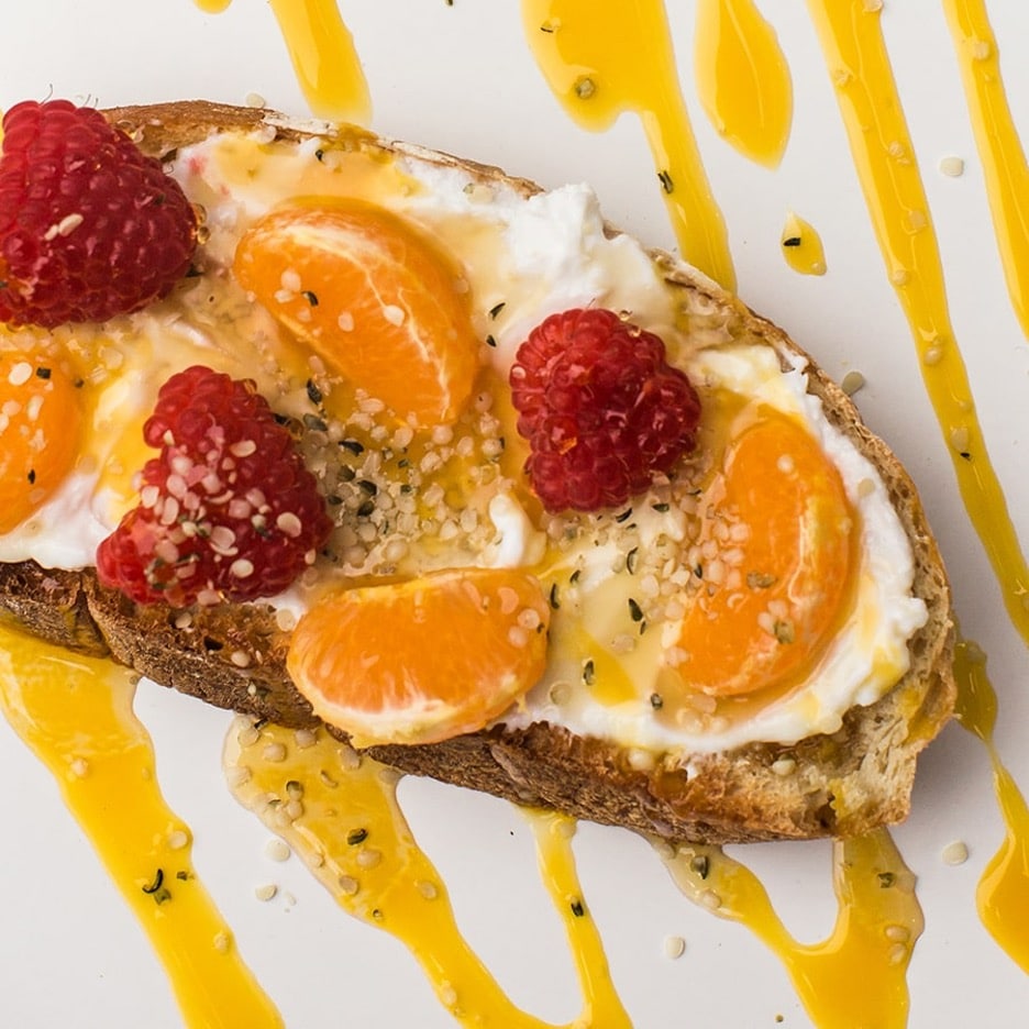 Toast with Yogurt Spread, Clementines, Raspberries & Mango.